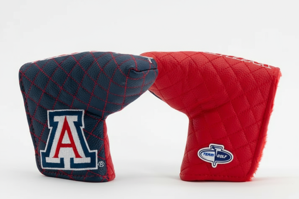 Two quilted golf club covers, one blue with a logo and one red with a different logo, on a white background.