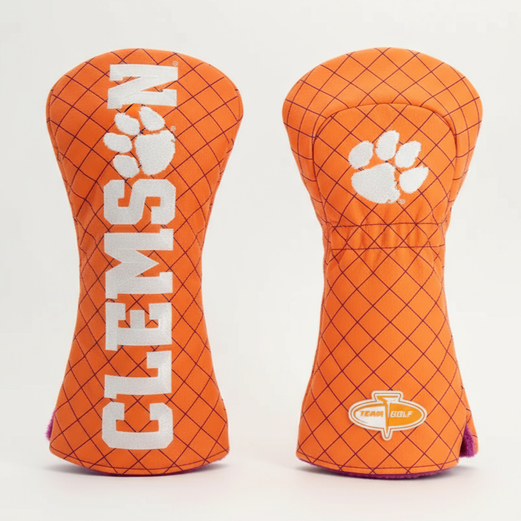 Two orange golf club head covers with 'Clemson' branding on a light gray background