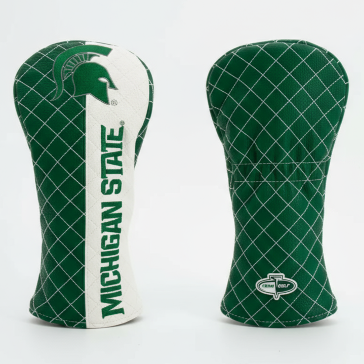 Two green and white golf club head covers with Michigan State branding on a light gray background.