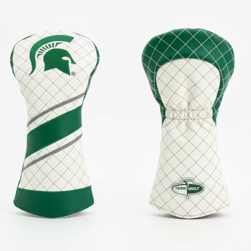 Two green and white golf club head covers on a light gray background