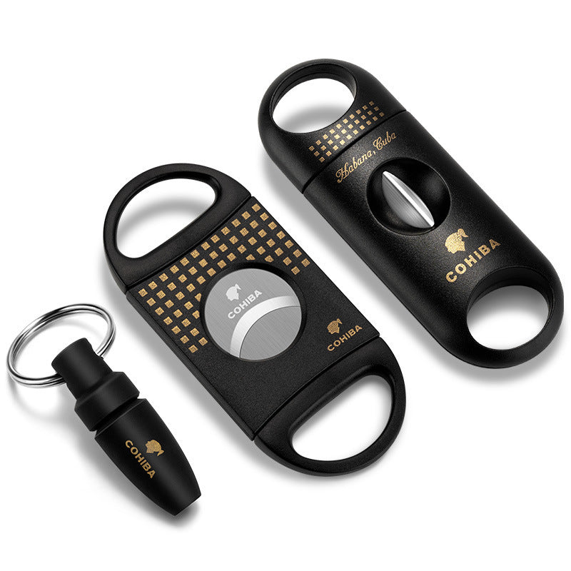 Cohiba black and gold cigar cutter set on a white background