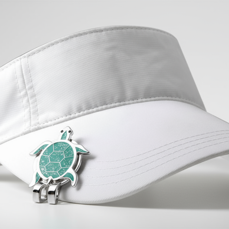 White visor cap with a green and silver turtle emblem on a white background
