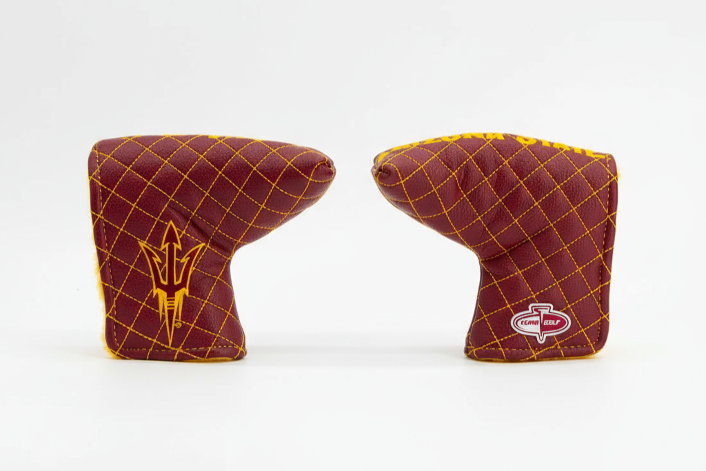 Two maroon and gold golf club head covers on a white background