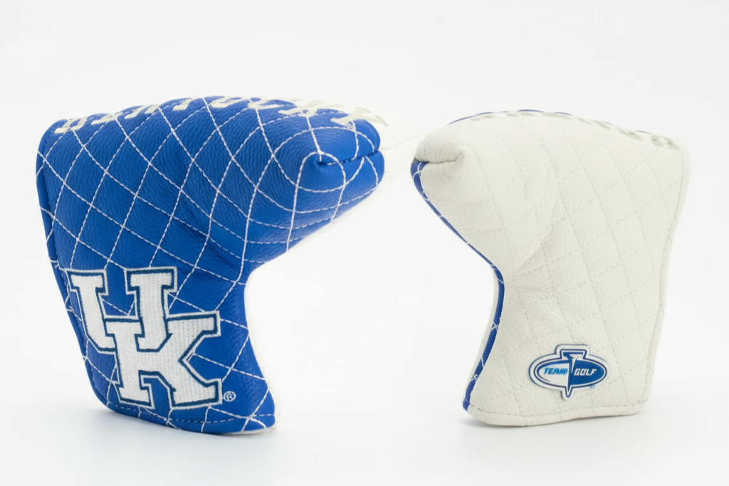 Two golf club covers, one blue with a grid pattern and 'UK' logo, the other white with a blue logo, on a white background.