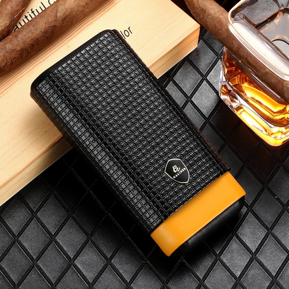GALINER leather cigar case closed – black embossed grid exterior with yellow cedar accent, lifestyle shot with whiskey and cigars
