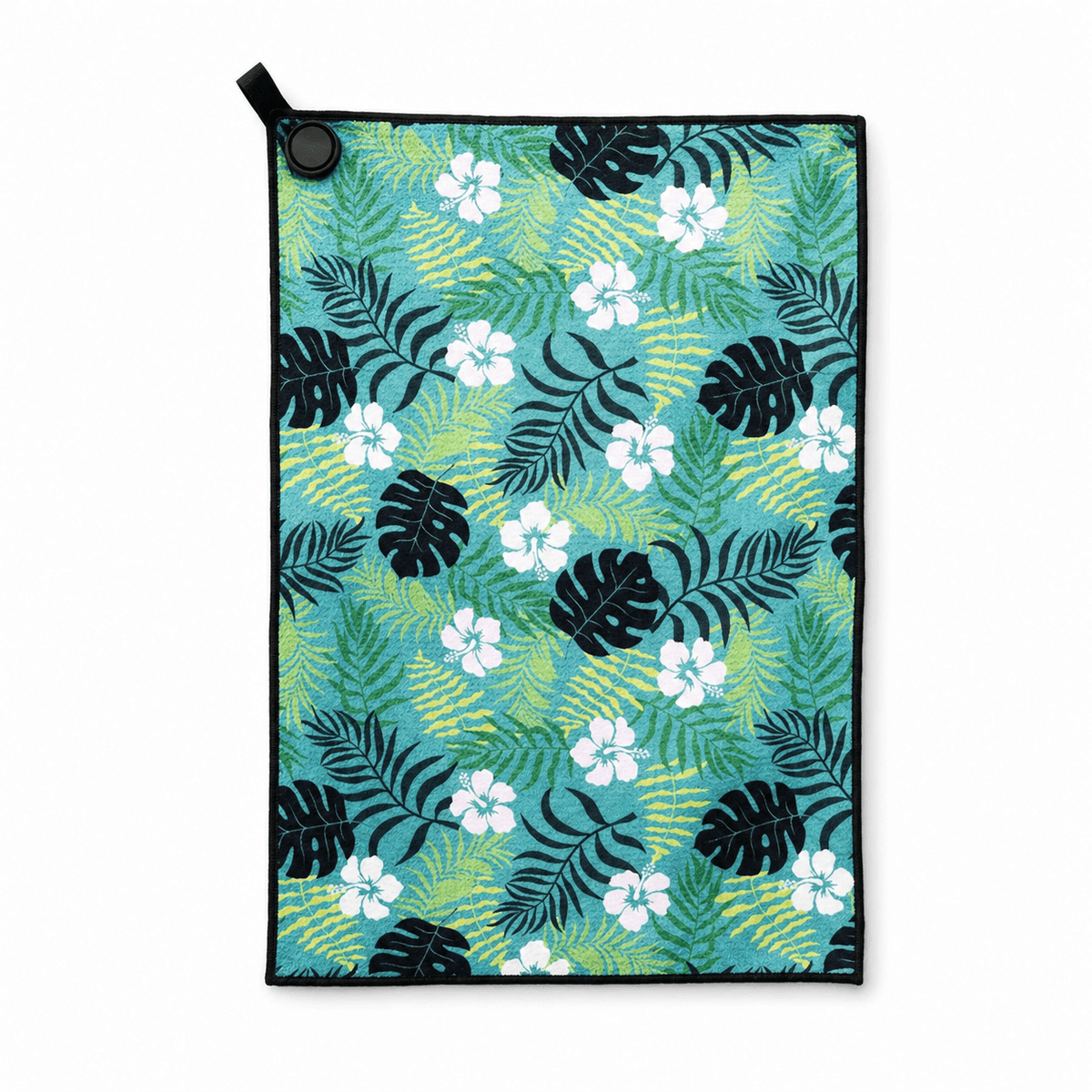 Towel with tropical leaf and flower pattern on a white background