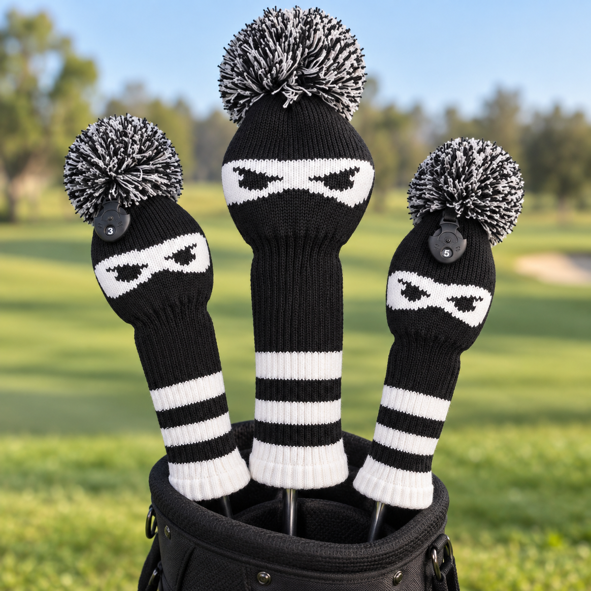 Three-piece ninja knit golf headcover set displayed on clubs in a black golf bag