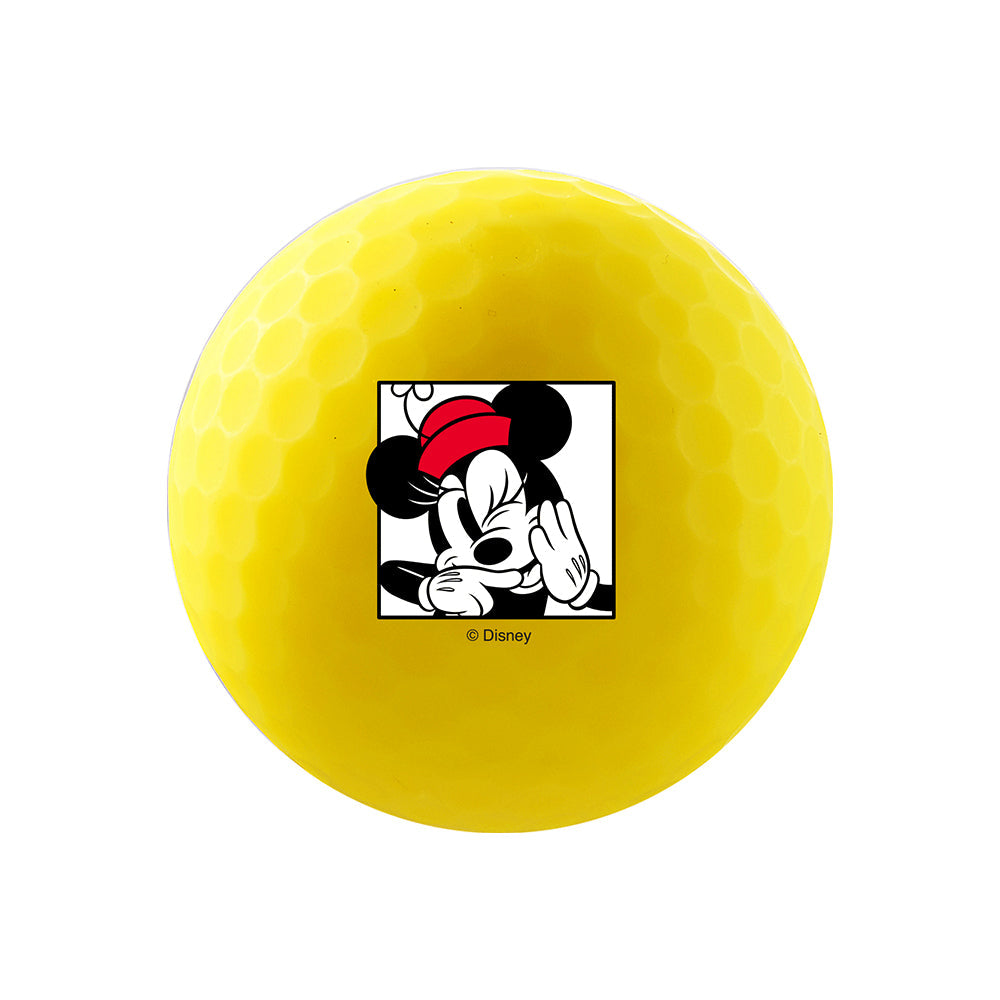 Close-up of a yellow Volvik Vivid Soft golf ball with Mickey and Minnie artwork