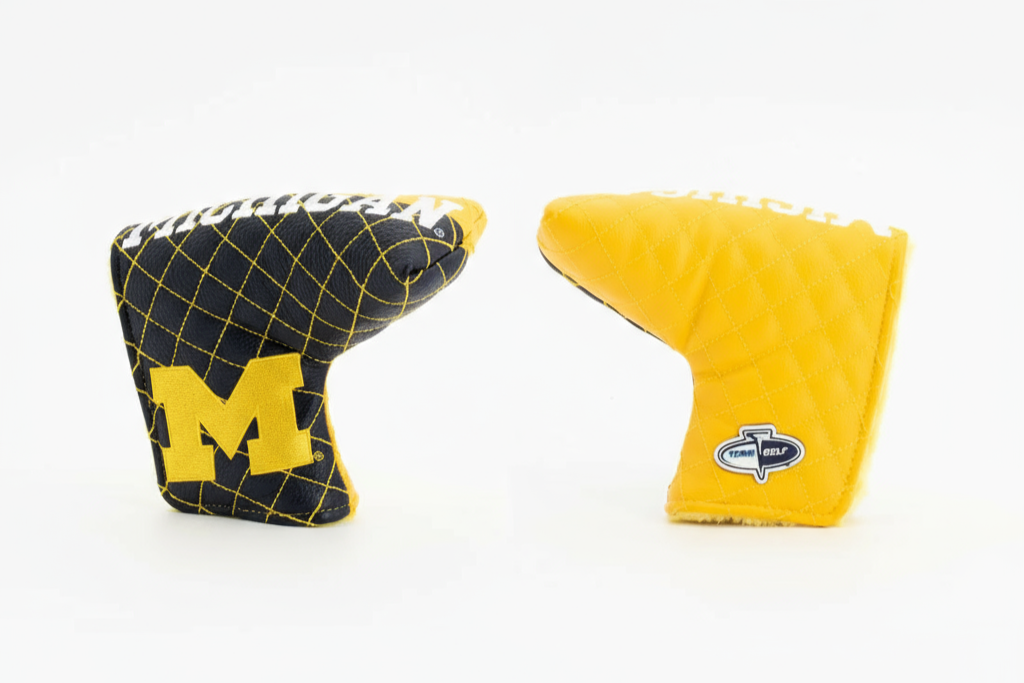 Two golf club covers, one with a yellow 'M' logo and the other with a different brand logo, on a white background.