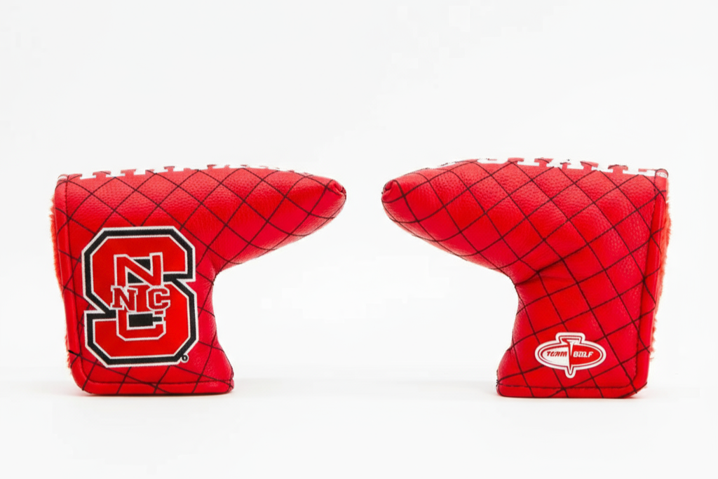 Two red golf club covers with logos on a white background