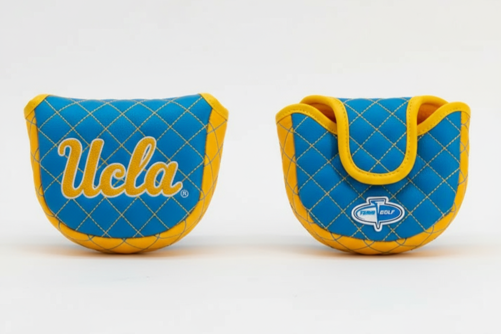 Two blue and yellow golf club covers with 'UCLA' branding on a white background