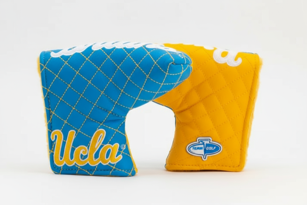 Two golf club covers, one blue with 'UCLA' text and the other yellow with a logo, on a white background.