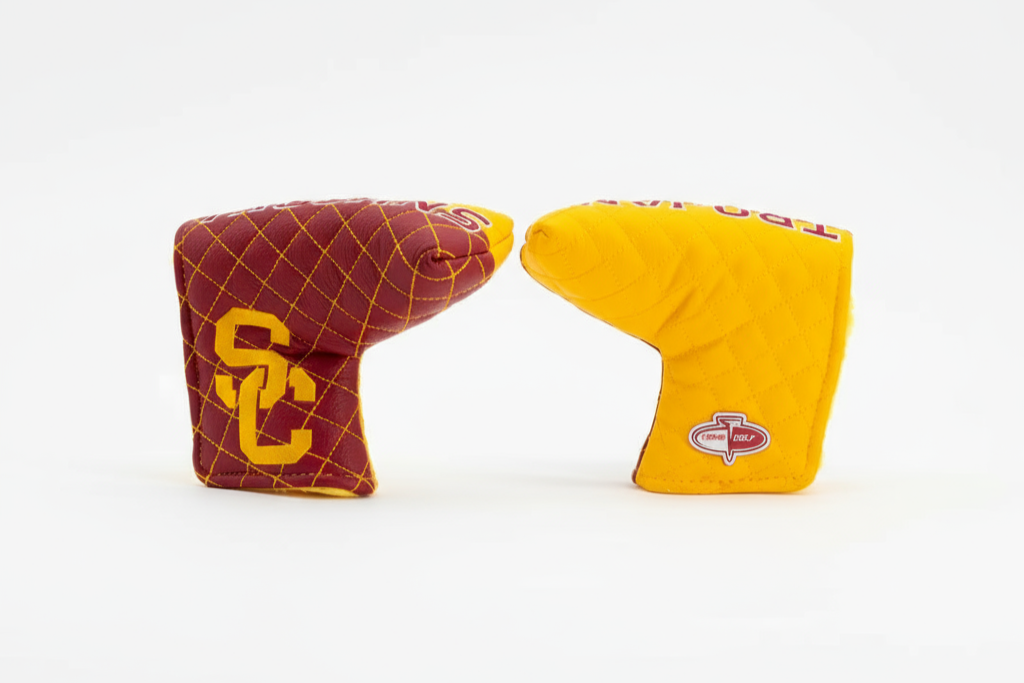 Two golf club covers, one red with yellow logo and one yellow with red logo, on a white background.