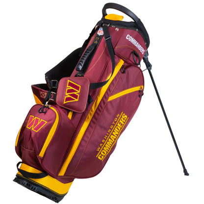 Washington Commanders golf stand bag in maroon and yellow, featuring team logos and a black stand leg extended, on a white background.
