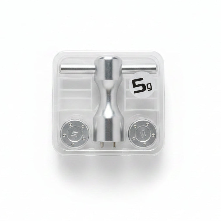 Metallic valve handle set in clear packaging on a marble surface
