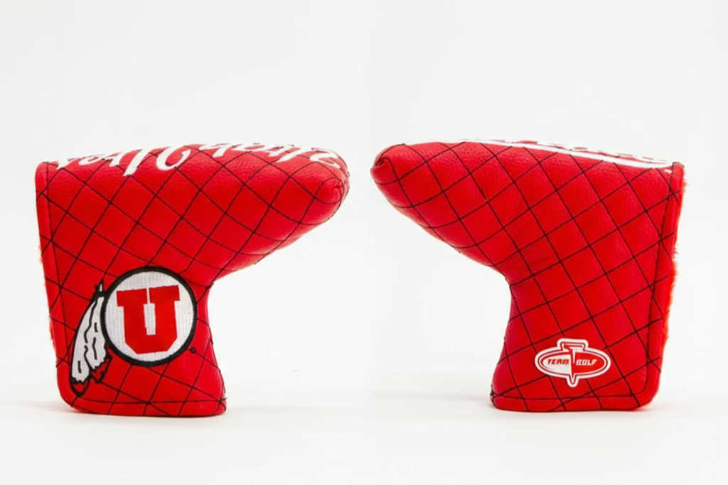 Two red golf club covers with logos on a white background