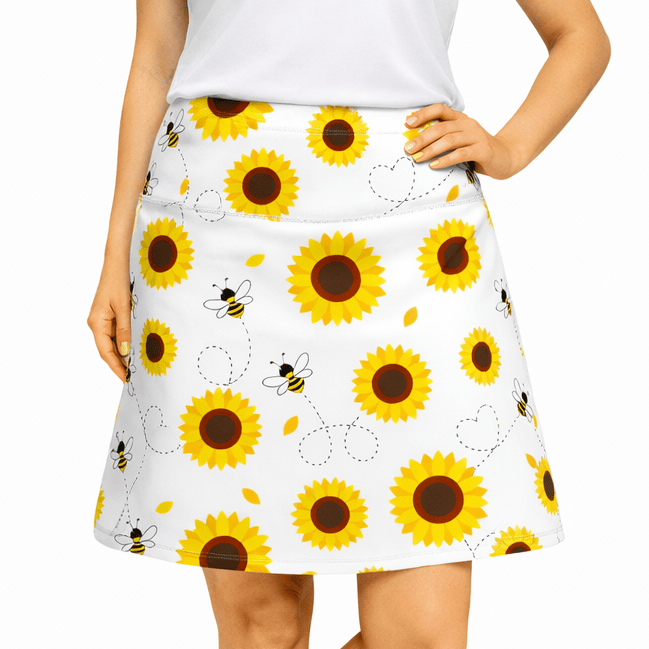 ReadyGOLF Let It Bee women’s golf skort with sunflowers and small bees on white