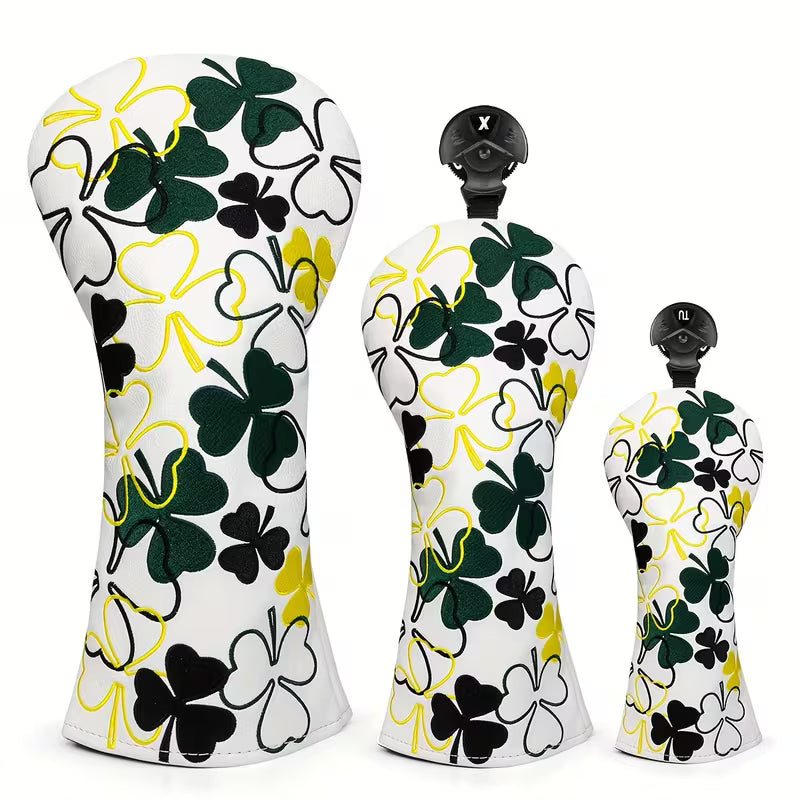 Golf club head covers with clover pattern on a white background