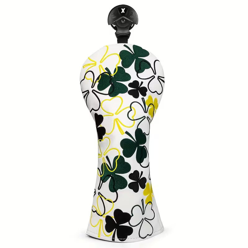 Decorative pepper grinder with clover leaf pattern on a white background