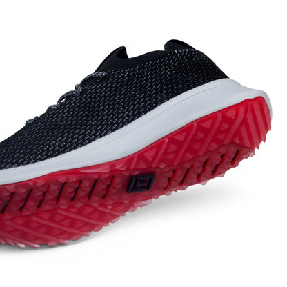 Tomo Alpha women's golf shoes in Carbon Black, angled view of the upper and outsole