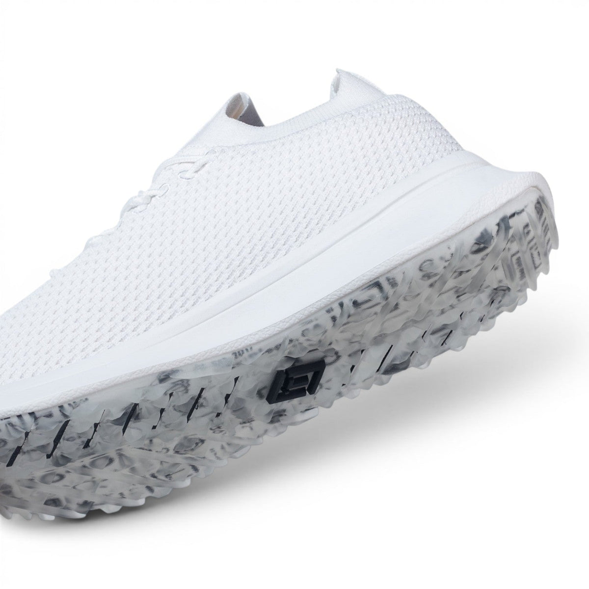 Tomo Alpha women's golf shoes in Hydrogen Snow, angled view of the upper and outsole