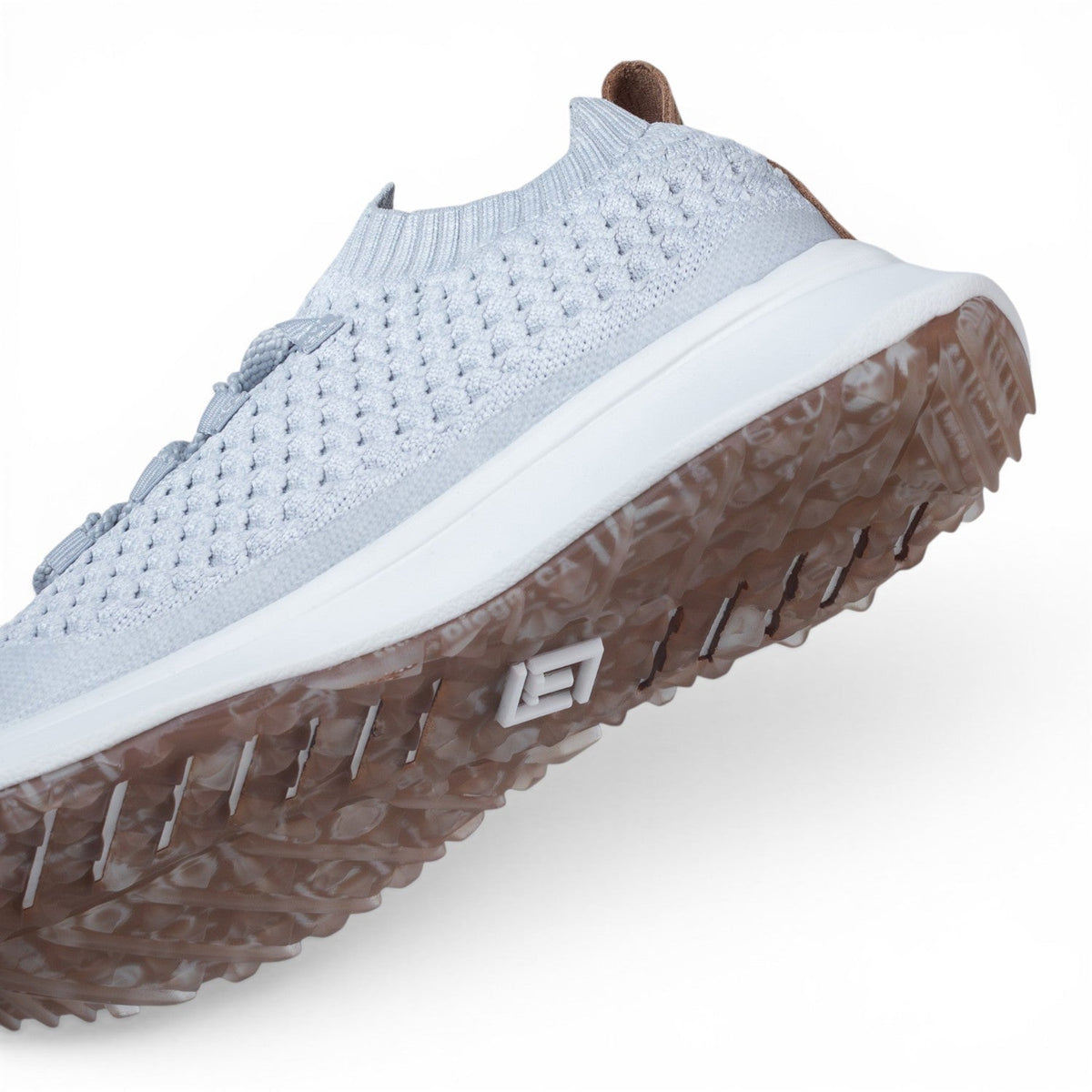 Tomo Bravo men's golf shoes in Frost Grey, angled view of the upper and outsole