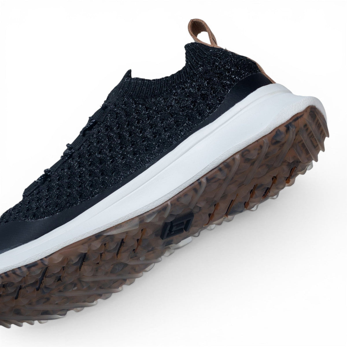 Tomo Bravo men's golf shoes in Ink Black, angled view of the upper and outsole