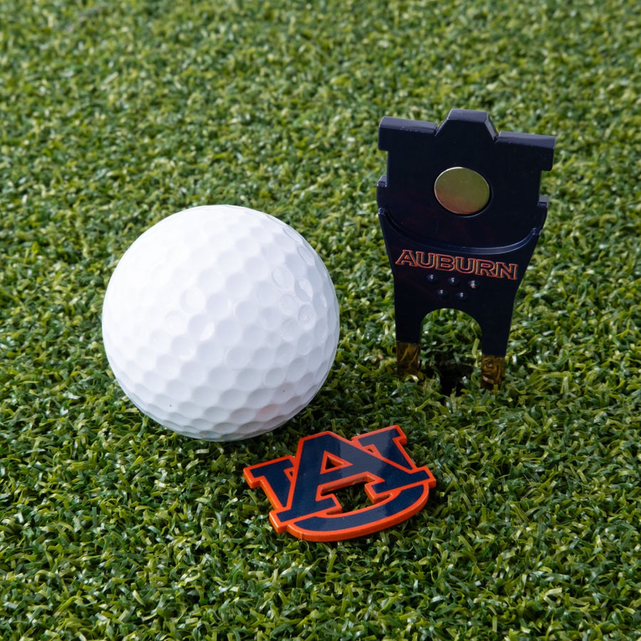 Auburn Tigers tool and its logo-shaped marker on the green