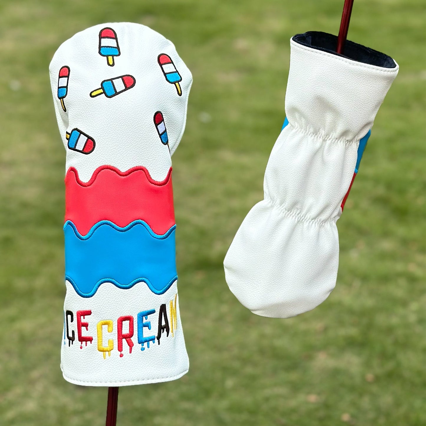 Golf club head cover with ice cream theme on a grass background