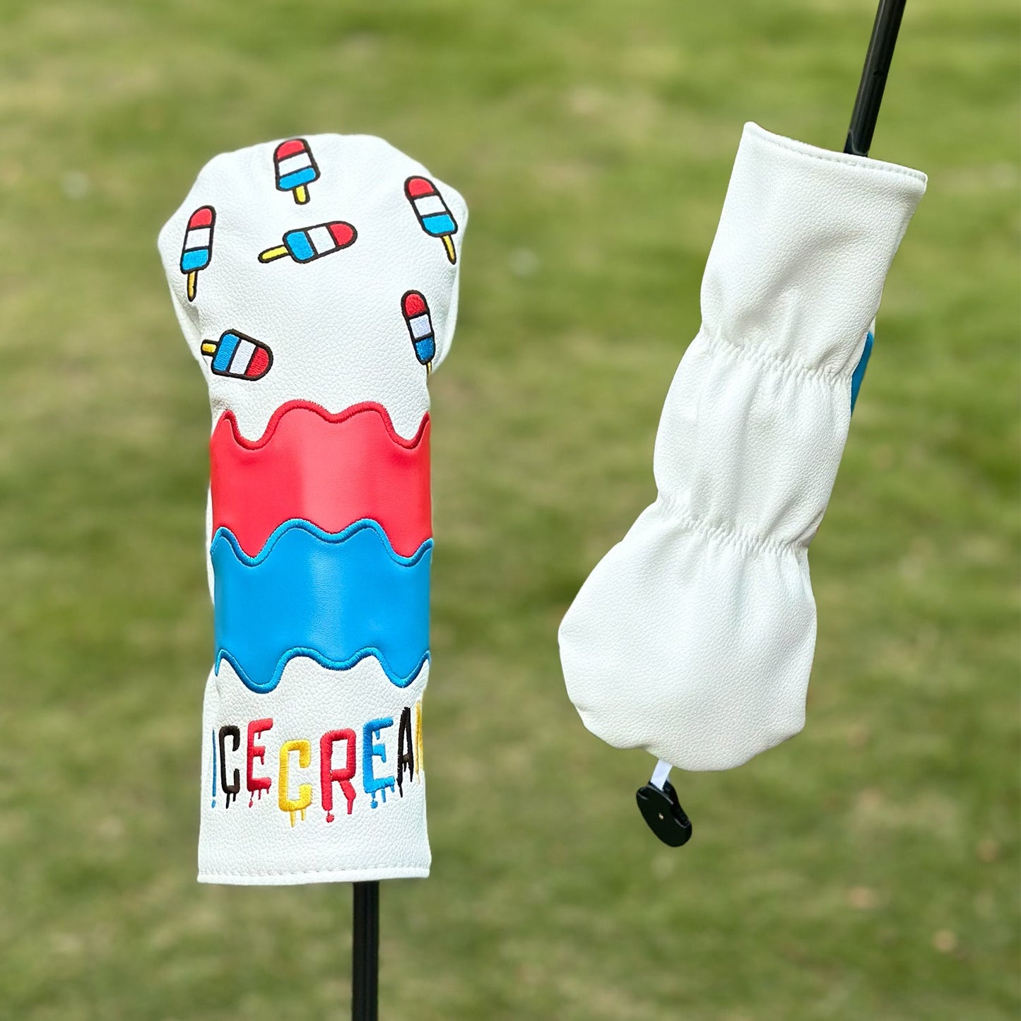 Golf club head cover with ice cream design on a grass background
