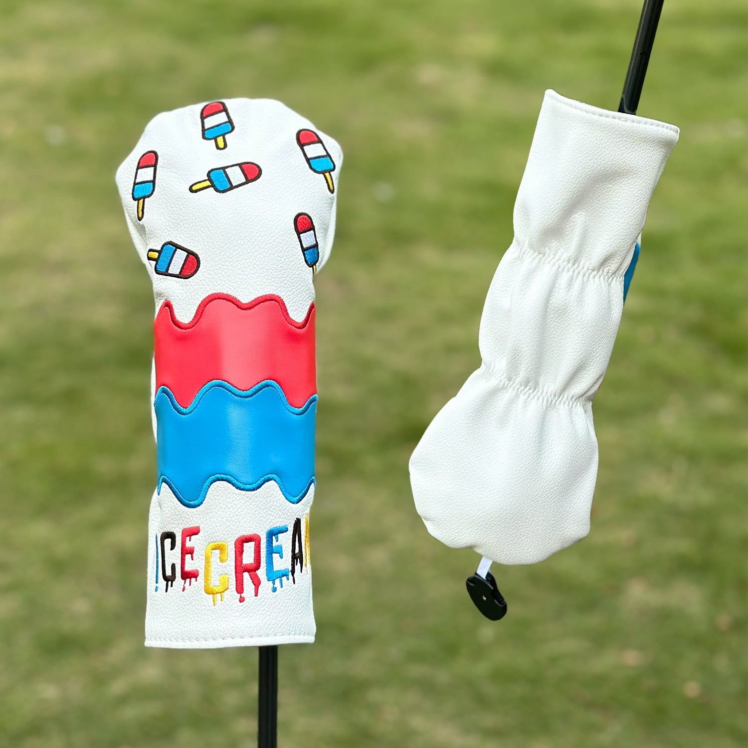 Golf club head cover with ice cream design on a grass background