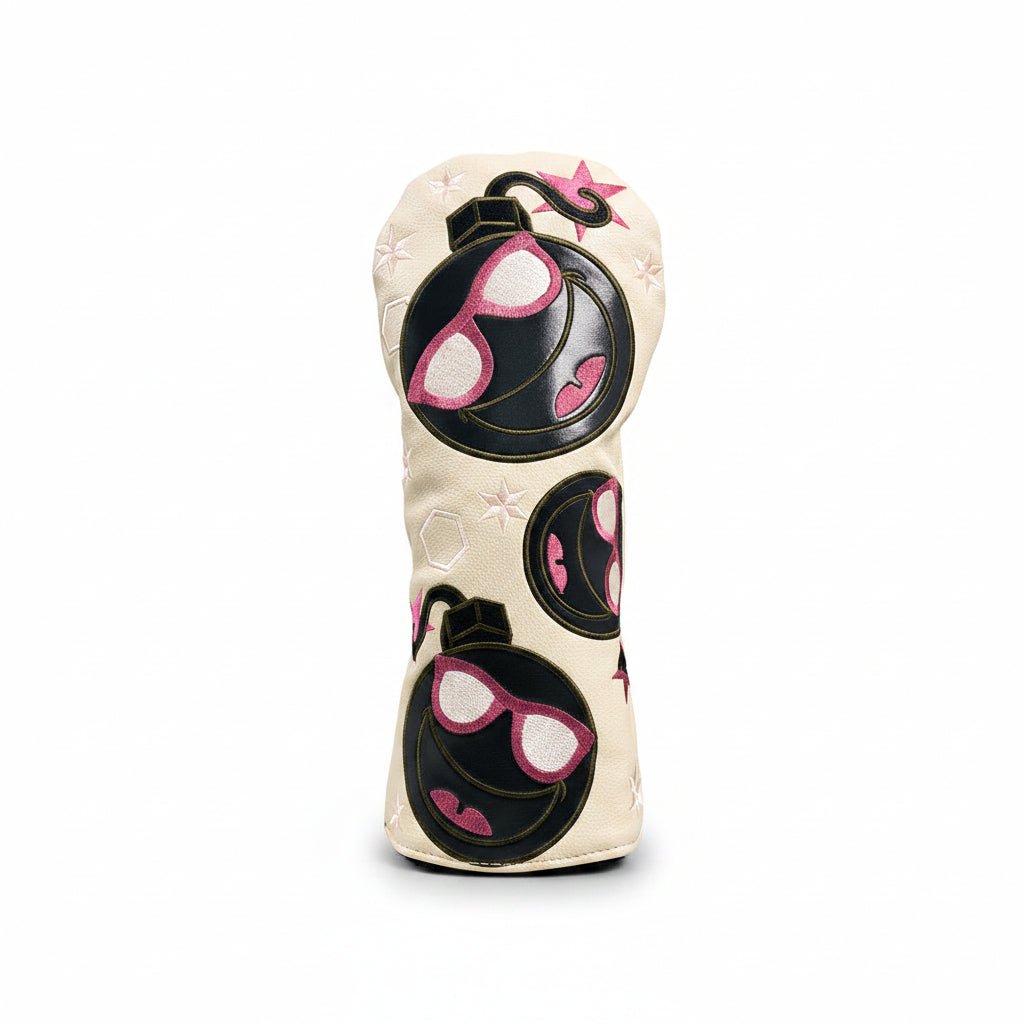 Golf club head cover with sunglasses design on grass