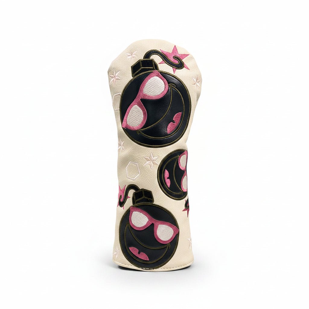 Golf club head cover with sunglasses design on grass