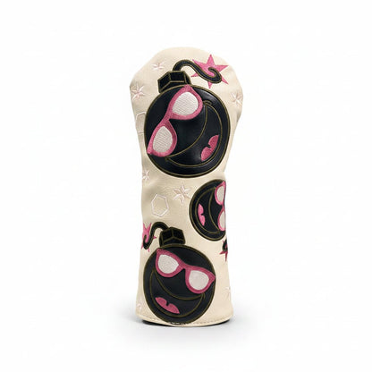 Golf club head cover with sunglasses design on grass