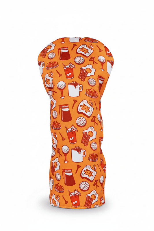 Orange driver headcover with food-themed pattern on a white background