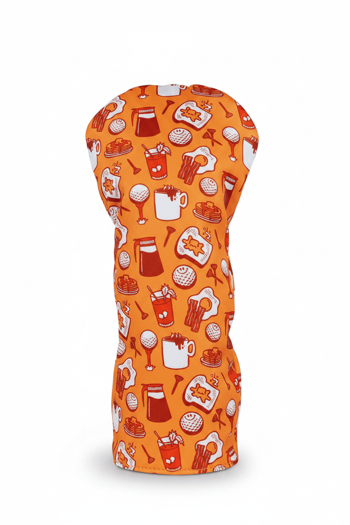 Orange driver headcover with food-themed pattern on a white background