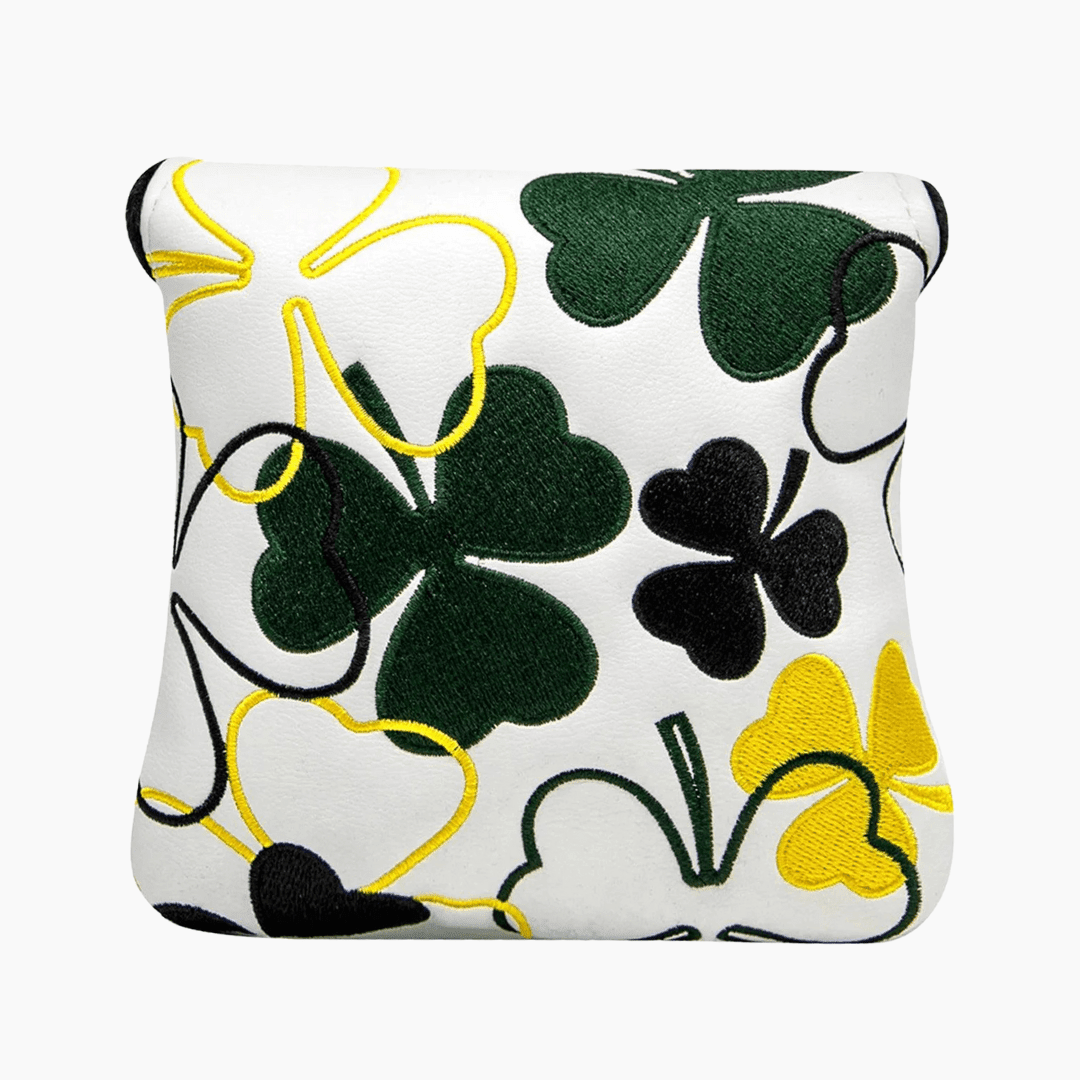 Decorative pillow with clover leaf pattern on a white background