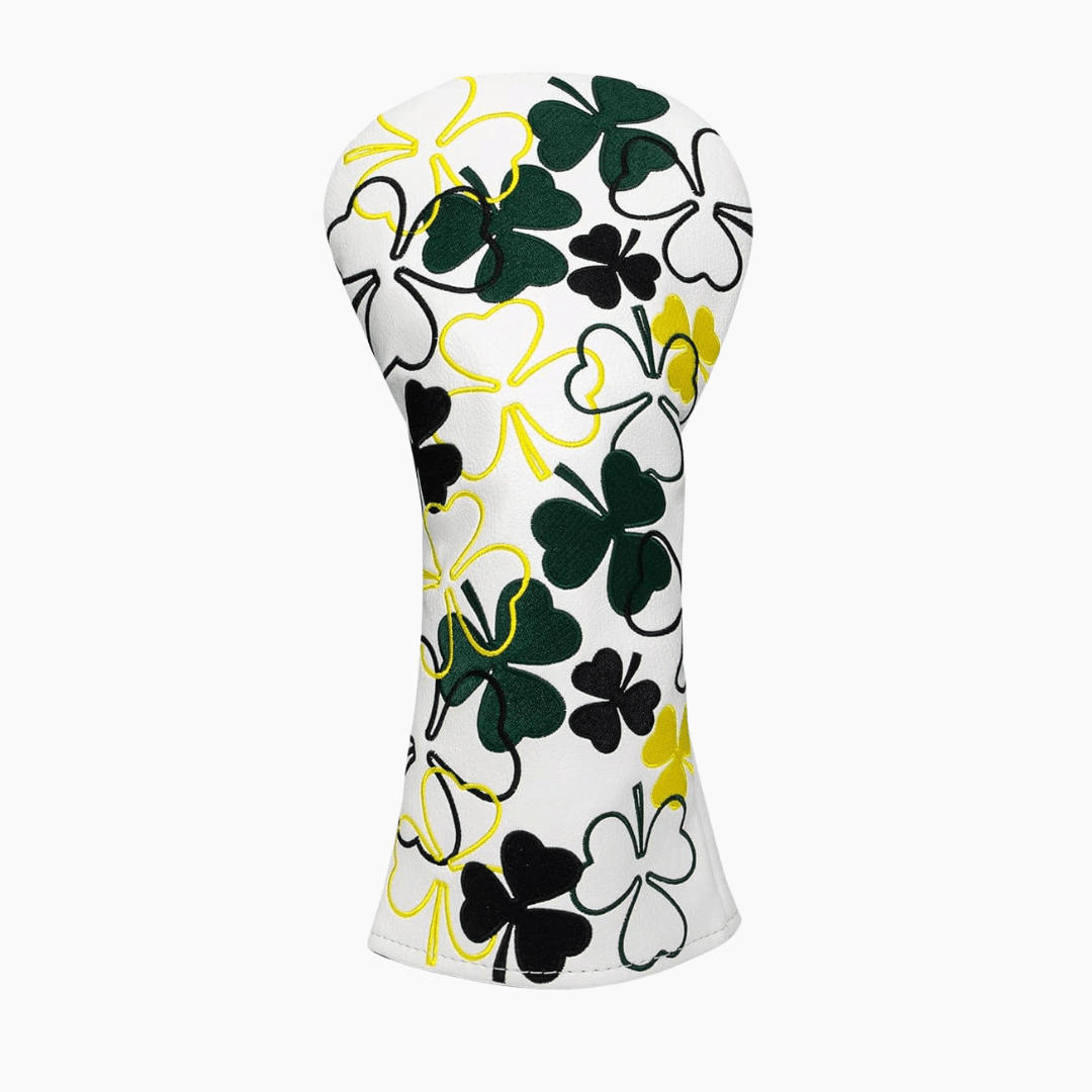 White golf club head cover with black, green, and yellow clover pattern on a white background