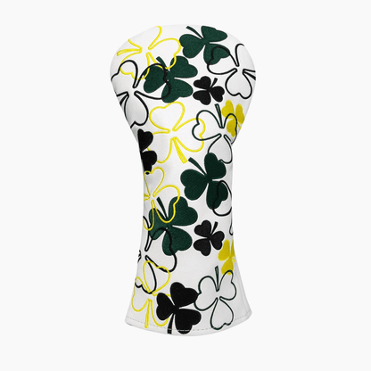 White golf club head cover with black, green, and yellow clover pattern on a white background