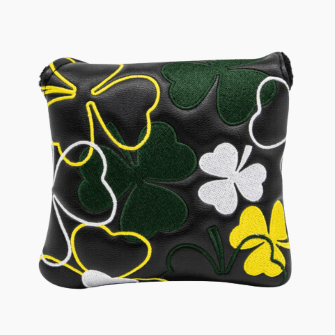 Black pouch with green shamrock patterns on a white background