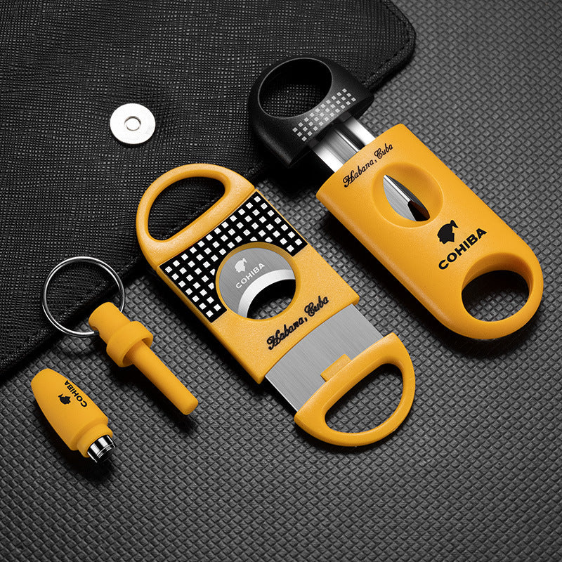 Cohiba cigar accessories set on a textured black surface