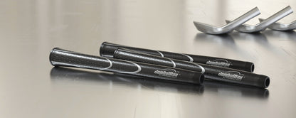 Black and silver Tour Series grips on a work surface