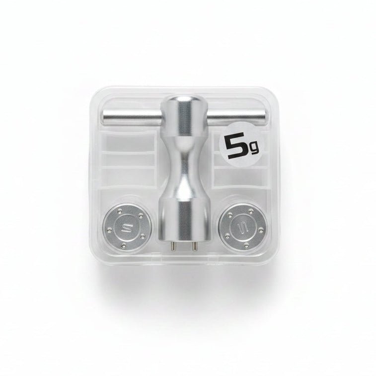 Metallic valve handle set in clear packaging on a marble surface