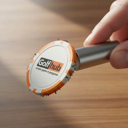 Golf hub device held by a hand on a wooden surface