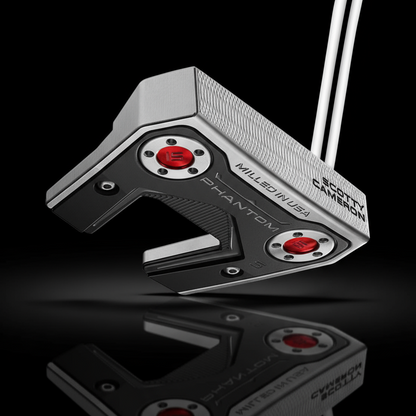 Scotty Cameron golf putter head on a black background
