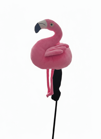 Pink flamingo toy on a stick against a white background