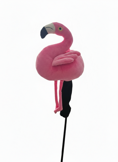 Pink flamingo toy on a stick against a white background