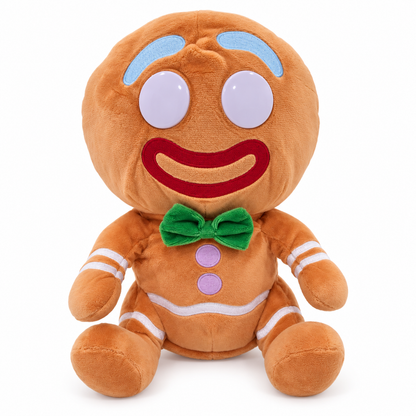 A plush gingerbread person toy with a round head, large white eyes, a red embroidered smile, light blue eyebrows, a green bow tie, and white stripe details on a plain white background.