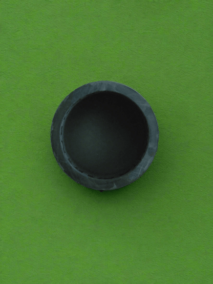 A black rubber golf ball pickup retriever