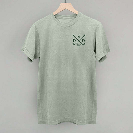 Muted green Golf Dad tee with small crossed-club left-chest graphic